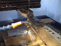 EDM small hole drilling and EDM services on a current hole burning machine, at MILCO Wire EDM